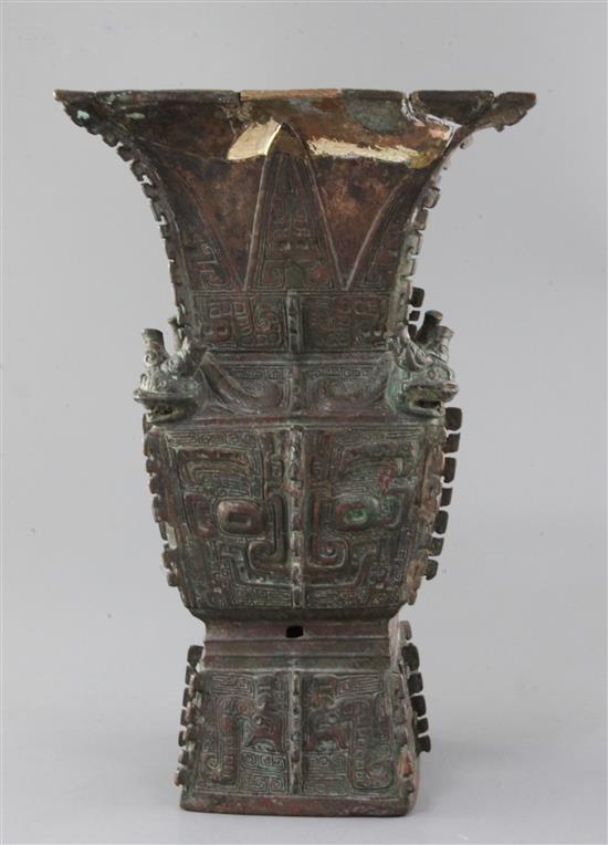 A rare Chinese archaic bronze ritual wine vessel, Fangzun, Shang dynasty, 13th-11th century B.C., 33.5cm high, losses and repairs